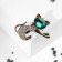 Brooch "Kit" with a bow, the color is emerald white in gold