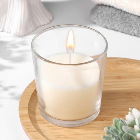 Candle in a smooth glass flavored "jasmine", 8.5 cm