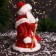 Santa Claus "In a fur coat with folding sleeves and a staff" 30 cm, moves, red