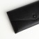 Women's wallet on the button, black color