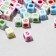 Acrylic bead "numbers" mix, cube 6 × 6 mm, set 10 g, color mix