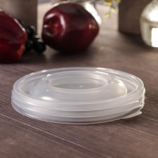 The plastic disposable lid to the container 
