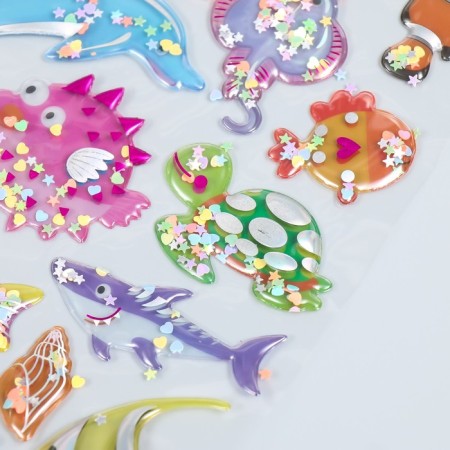 The plastic sticker is voluminous with glitter "dinosaurs/fish" gold/silver mix-3