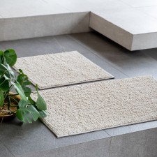 A set of bathtub rugs 
