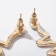 Hanging earrings with the rhinestones "snake" curved, white color in gold, 5.7 cm