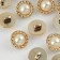 A button on the leg, with pearls, d = 15 mm, gold color