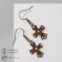 Earrings "Crosses" Flower, white color in black gold