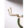 Bracelet with rhinestones "shine" on a puff, emerald color in gold