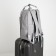 A backpack of textiles on a zipper, 3 pockets, a laptop, color gray