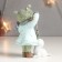 Souvenir Polystone "Baby feeds a fish catfish with a 7x9x13 cm