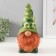 The piggy bank "Gnome Scandil" is height 22.5 cm, width 9.5 cm, length 11.5 cm.