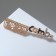 Brooch "Comb" COMB, black and white color in pink gold