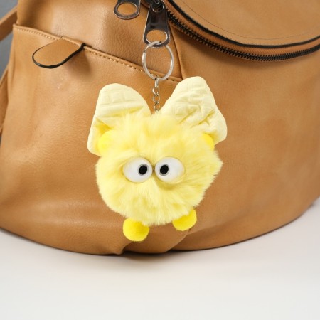 Fluffy on the ring "Masya with a large bow" yellow 12x8x8 cm