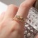 Ring "melting" double, white color in gold, dimensionless
