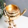 Summary Metal for 1 candle "Trinoga with a dome" gold 24x13x13 cm