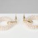 Earrings with pearls "circles" on the ring, the color is white in gold