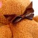 Soft toy "Bear with a bow", on a key fob, size 14 cm, brown color