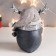 Polystone souvenir "Penguin in a scarf and cap with horns, with a gift" Mix 15.5x13x9 cm