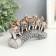 Polystone souvenir "Five elephants on a tusk with flowers" silver 17x4x8 cm