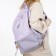 A backpack with a zipper, 4 outer pockets, lilac color