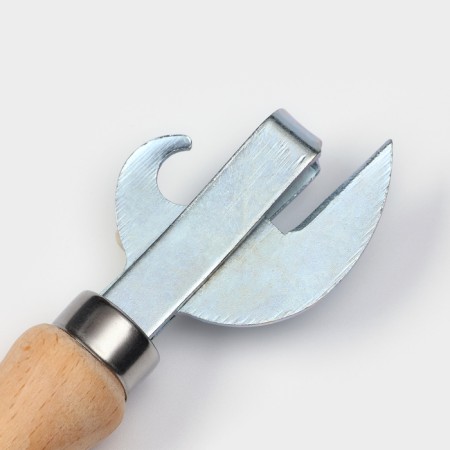 The opener is not riveted, 17 × 4 cm, zinc, with a wooden handle made of beech-2
