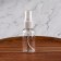 A bottle for storage, with a spray, with a division scale, 30 ml, white/transparent color
