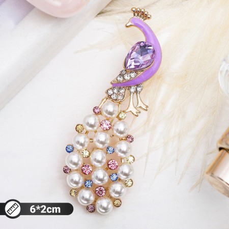 Brooch "Peacock" with a pearl tail, colored in gold