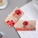 An envelope for money with a decorative element "Happy Anniversary!" embossing, roses, 16.5x8.5 cm