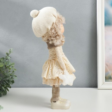 Interior doll "Baby in beret, in a beige outfit, with a flower" 36.5x13x17 cm-1