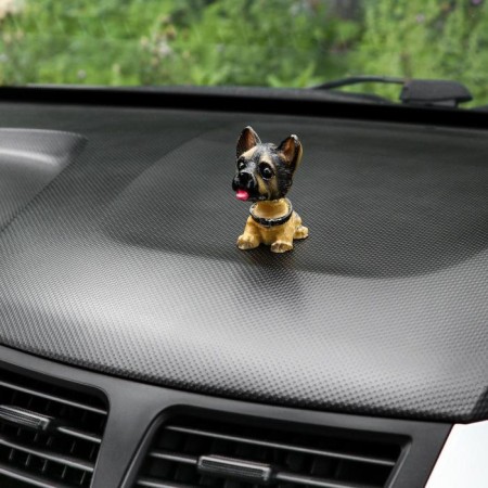 Dog on a car panel shocking his head, German shepherd-1