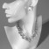 Set 4 objects: earrings, necklaces, bracelet, “evening” ring volume, white in silver
