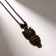 A pendant on the lace "Filin", the color is brown-black on a black lace, 80 cm