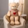 Soft toy "Bear", in a knitted jacket, 100 cm, beige color