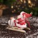Santa Claus "In a suit with patterns and fur shoes, on a sleigh" 13 cm, red-white