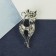 Brooch "Cat" elegant with a bow, white color in silver