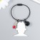 Acryl keychain on a cable with a bell "Bearded guy with glasses and rose"