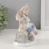 Souvenir Ceramics "Clown on a chest with a dog" 8.7x11x15 cm