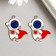 Decor for creativity metal, enamel "Cosmonaut in a red cloak" gold 3.1x2.5 cm