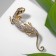 Brooch "Lizard" is narrow, white color in gold