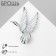Brooch "Bird" in flight, white color in silver