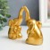 Souvenir Polystone "Two small elephants" gold set 2 pcs 3.5x4x8.8 cm