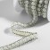 Rhinestones and beads are thermoclayes, width - 11 mm, 4.5 ± 0.5 m, silver color