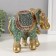 Souvenir Polystone "Elephant with an elephant, chamomile on the ass" red-blue, sparkle 17x10x15 cm 10325