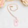 Piece "chosen" heart with a bow, pink color in gold