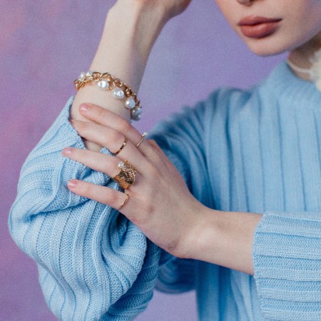 Ring "crumpled lines" with bead, white color in gold, dimensionless-3