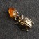 Talisman Talisman "God's cow", brass, amber