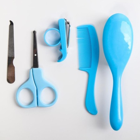 A child care set, 5 items: brush, comb, safe scissors, files and nail tongs, blue color