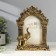 Photo frame Polystone 10x15 cm "Indian elephant" aged gold 21.5x15.8x5 cm