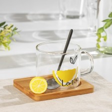 Glass mug with a wooden stand and spoon 