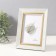 Photo frame plastic 10x15 cm "Violett" light gray with a gold stripe 1.5x14.4x19.4 cm